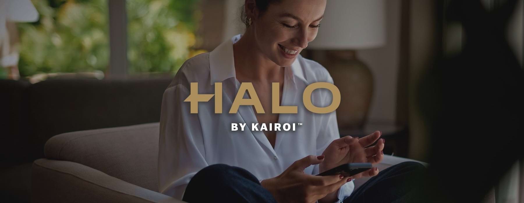 a woman smiling and interacting with her device