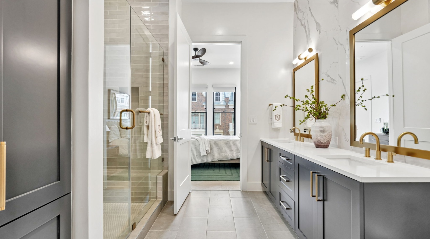 Walk in shower with black cabinets