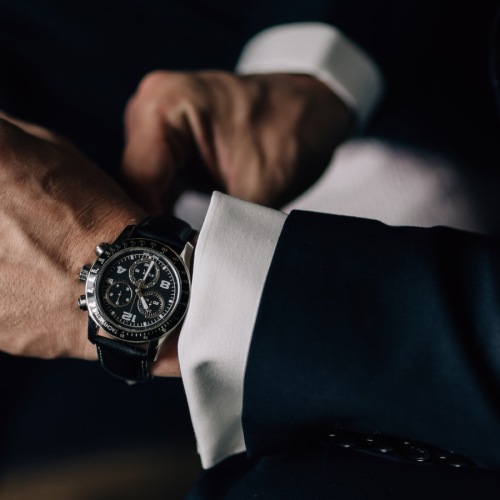 Timeless Luxury a person with a suit and watch on