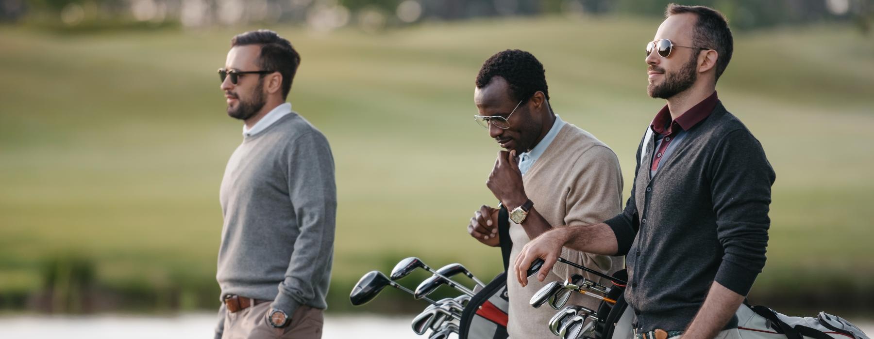 a group of men on a golf course